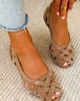 Flat open-toe sandals with crisscrossed fabric