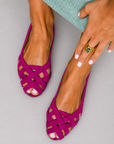 Flat open-toe sandals with crisscrossed fabric