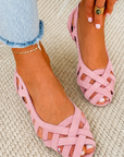 Flat open-toe sandals with crisscrossed fabric