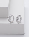 Silver earrings in the shape of a leaf