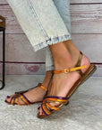 Golden sandals with buckle and multicolor strap