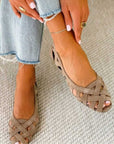 Flat open-toe sandals with crisscrossed fabric