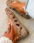 Flat open-toe sandals with crisscrossed fabric