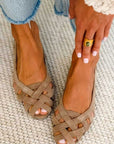 Flat open-toe sandals with crisscrossed fabric