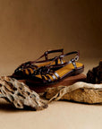 Metal stud sandals with openings in dark brown