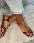 Golden sandals with buckle and multicolor strap