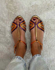 Golden sandals with buckle and multicolor strap