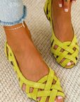 Flat open-toe sandals with crisscrossed fabric