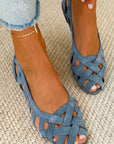 Flat open-toe sandals with crisscrossed fabric
