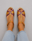 Golden sandals with buckle and multicolor strap